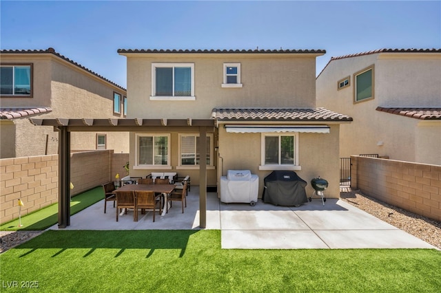 8055 Tank Loop St, Las Vegas, NV 89166 - back of house featuring a tiled roof, stucco siding, and a patio