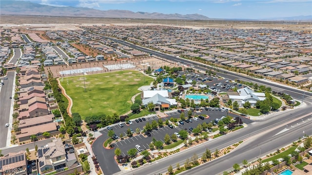 8055 Tank Loop St, Las Vegas, NV 89166 - aerial view of property and surrounding area with a mountain backdrop and nearby suburban area