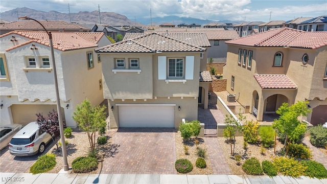 8055 Tank Loop St, Las Vegas, NV 89166 - view of front of home with a residential view, stucco siding, and a tiled roof