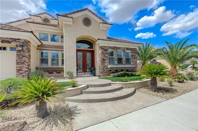 2168 Big Bar Dr, Henderson, NV 89052 - property entrance with french doors, stone siding, and stucco siding