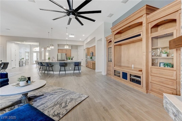 2168 Big Bar Dr, Henderson, NV 89052 - living room featuring ceiling fan and light wood-style flooring