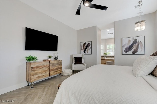 2168 Big Bar Dr, Henderson, NV 89052 - bedroom featuring ensuite bath, ceiling fan, and a chandelier