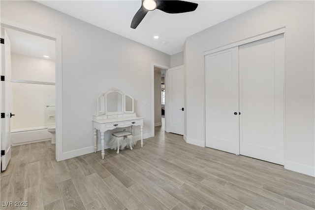 2168 Big Bar Dr, Henderson, NV 89052 - bedroom with light wood-style flooring, baseboards, ensuite bath, a closet, and recessed lighting