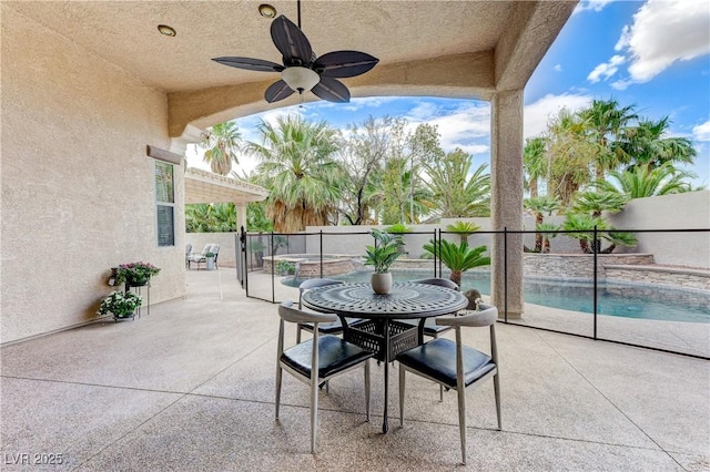 2168 Big Bar Dr, Henderson, NV 89052 - fenced backyard with a patio, a jacuzzi, and a ceiling fan