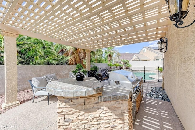 2168 Big Bar Dr, Henderson, NV 89052 - fenced backyard featuring an outdoor kitchen, a pergola, and a patio area
