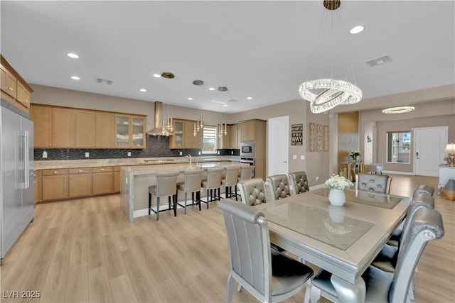 7258 W Le Baron Ave, Las Vegas, NV 89178 - dining space with light wood-style floors, a chandelier, and recessed lighting