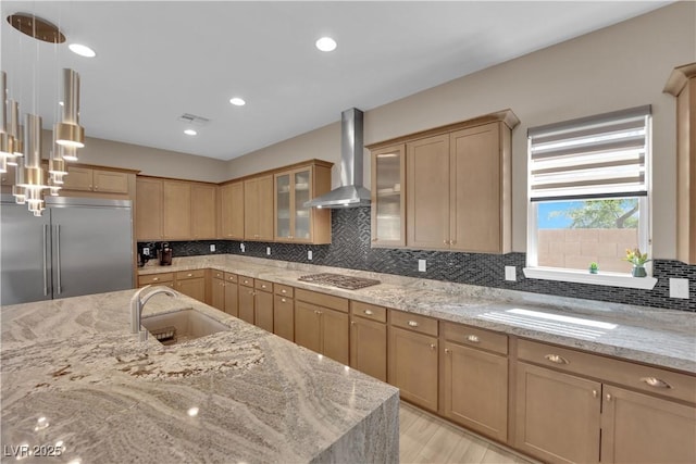 7258 W Le Baron Ave, Las Vegas, NV 89178 - kitchen featuring wall chimney exhaust hood, appliances with stainless steel finishes, a sink, decorative backsplash, and light stone countertops