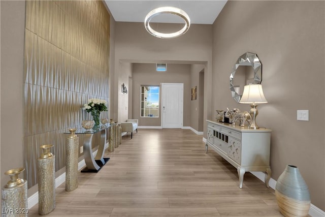 7258 W Le Baron Ave, Las Vegas, NV 89178 - foyer entrance with light wood finished floors, baseboards, and a towering ceiling