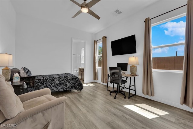 7258 W Le Baron Ave, Las Vegas, NV 89178 - bedroom with wood finished floors, a desk, baseboards, and ceiling fan