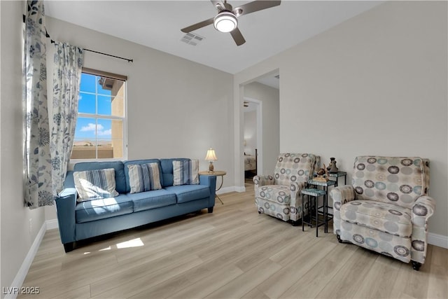 7258 W Le Baron Ave, Las Vegas, NV 89178 - living room featuring wood finished floors, ceiling fan, and baseboards