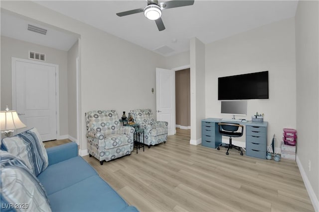 7258 W Le Baron Ave, Las Vegas, NV 89178 - living room featuring a desk, wood finished floors, a ceiling fan, and baseboards