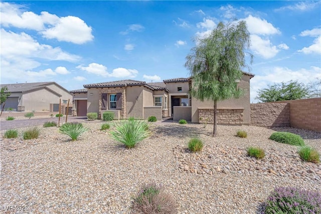 7258 W Le Baron Ave, Las Vegas, NV 89178 - view of front of house featuring stucco siding, a tiled roof, an attached garage, and a gate