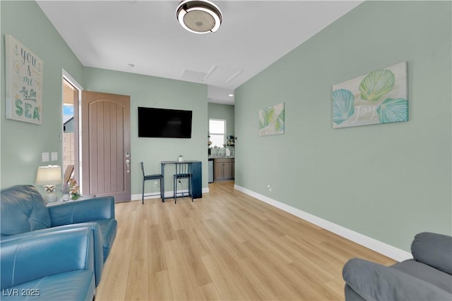 7258 W Le Baron Ave, Las Vegas, NV 89178 - living area featuring light wood finished floors, baseboards, and attic access