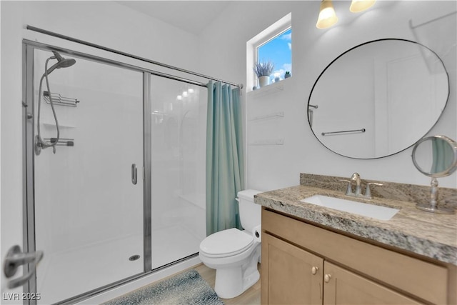 7258 W Le Baron Ave, Las Vegas, NV 89178 - full bathroom with a shower stall, vanity, toilet, and wood finished floors
