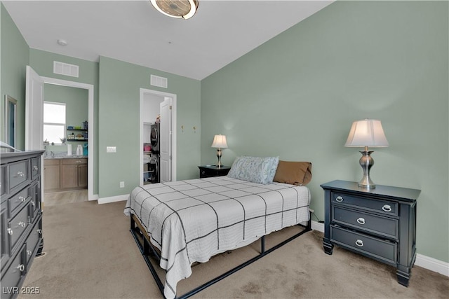 7258 W Le Baron Ave, Las Vegas, NV 89178 - carpeted bedroom with stacked washer / drying machine, a walk in closet, a closet, and baseboards