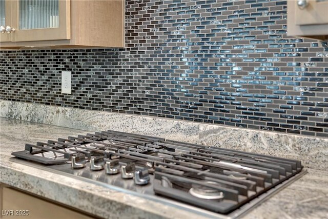 7258 W Le Baron Ave, Las Vegas, NV 89178 - kitchen view of stainless steel gas cooktop and decorative backsplash