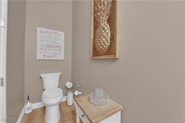 7258 W Le Baron Ave, Las Vegas, NV 89178 - half bathroom with toilet, wood finished floors, and baseboards