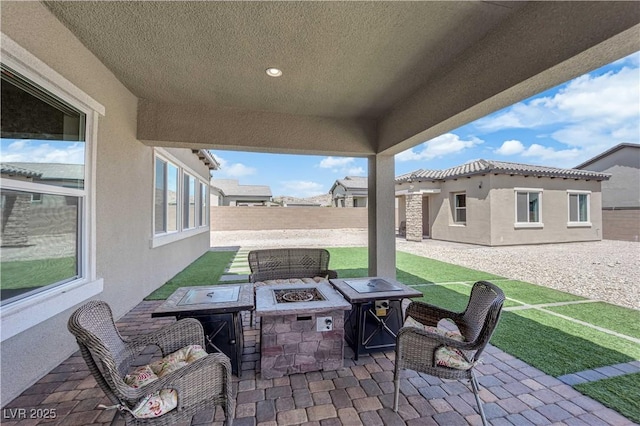 7258 W Le Baron Ave, Las Vegas, NV 89178 - view of patio featuring an outdoor fire pit