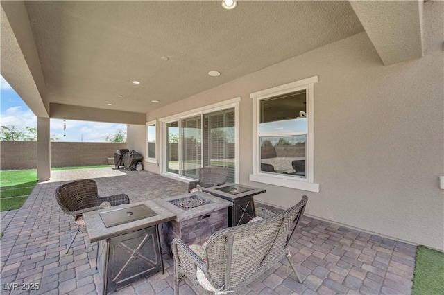 7258 W Le Baron Ave, Las Vegas, NV 89178 - view of patio / terrace featuring a fire pit