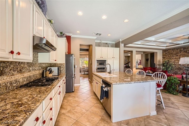 4719 Riva De Romanza St, Las Vegas, NV 89135 - kitchen featuring under cabinet range hood, stainless steel appliances, light tile patterned floors, a breakfast bar, and recessed lighting