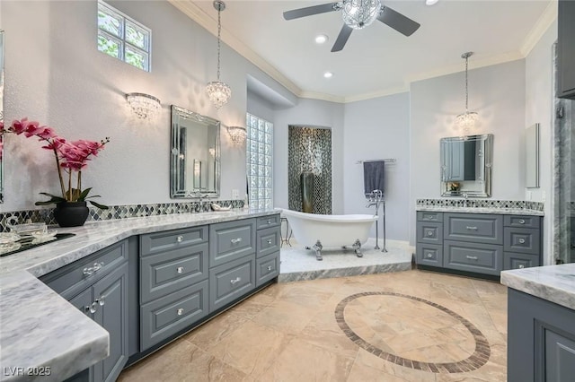 4719 Riva De Romanza St, Las Vegas, NV 89135 - full bathroom featuring a ceiling fan, two vanities, a soaking tub, crown molding, and recessed lighting