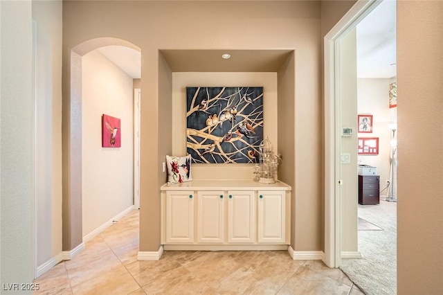 4719 Riva De Romanza St, Las Vegas, NV 89135 - corridor with arched walkways and light tile patterned flooring
