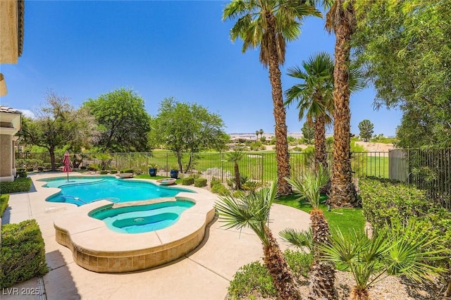 4719 Riva De Romanza St, Las Vegas, NV 89135 - view of swimming pool featuring a fenced backyard, a pool with connected hot tub, and a patio