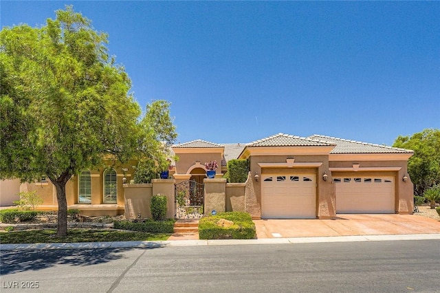 4719 Riva De Romanza St, Las Vegas, NV 89135 - view of front facade with stucco siding, a garage, driveway, a tile roof, and a gate