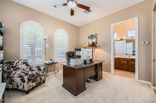 4719 Riva De Romanza St, Las Vegas, NV 89135 - home office featuring a ceiling fan, healthy amount of natural light, and light colored carpet