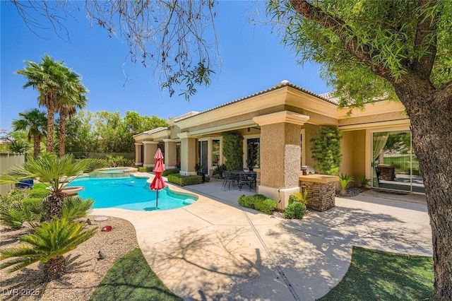 4719 Riva De Romanza St, Las Vegas, NV 89135 - view of swimming pool with a patio, a pool with connected hot tub, and outdoor dining space