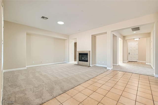 8305 Chapelle Ct, Las Vegas, NV 89131 - unfurnished living room featuring light carpet, baseboards, light tile patterned floors, a fireplace, and recessed lighting