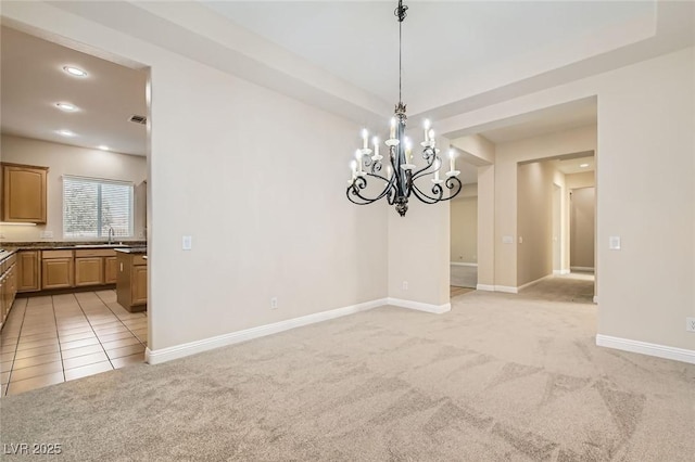 8305 Chapelle Ct, Las Vegas, NV 89131 - unfurnished dining area featuring light carpet, recessed lighting, baseboards, a chandelier, and a sink