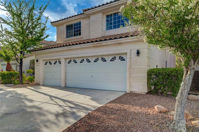 9772 Galahad Point Ct, Las Vegas, NV 89147 - view of front of property with concrete driveway, a tiled roof, and an attached garage