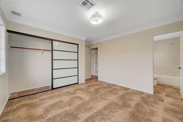 9772 Galahad Point Ct, Las Vegas, NV 89147 - unfurnished bedroom with a closet, ornamental molding, ensuite bathroom, and baseboards