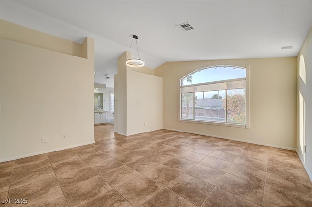 9772 Galahad Point Ct, Las Vegas, NV 89147 - unfurnished room featuring baseboards and vaulted ceiling