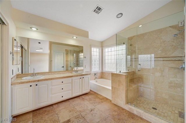 9772 Galahad Point Ct, Las Vegas, NV 89147 - full bath featuring lofted ceiling, a garden tub, a shower stall, double vanity, and recessed lighting