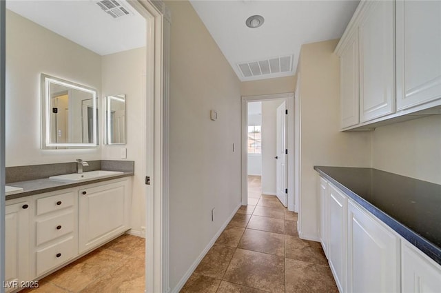 9772 Galahad Point Ct, Las Vegas, NV 89147 - hallway with a sink, baseboards, and vaulted ceiling