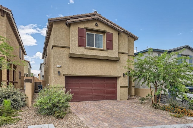10974 Cheshire Woods Ave, Las Vegas, NV 89166 - view of front of property featuring stucco siding, an attached garage, decorative driveway, and a tiled roof