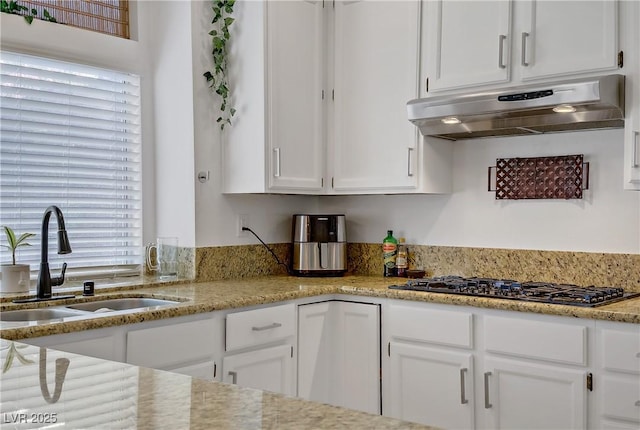 7621 Hackensack Ct, Las Vegas, NV 89128 - kitchen featuring exhaust hood, a sink, black gas stovetop, and white cabinetry