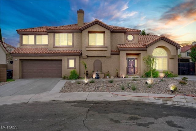 7621 Hackensack Ct, Las Vegas, NV 89128 - mediterranean / spanish-style house with stucco siding, concrete driveway, a chimney, and a tile roof