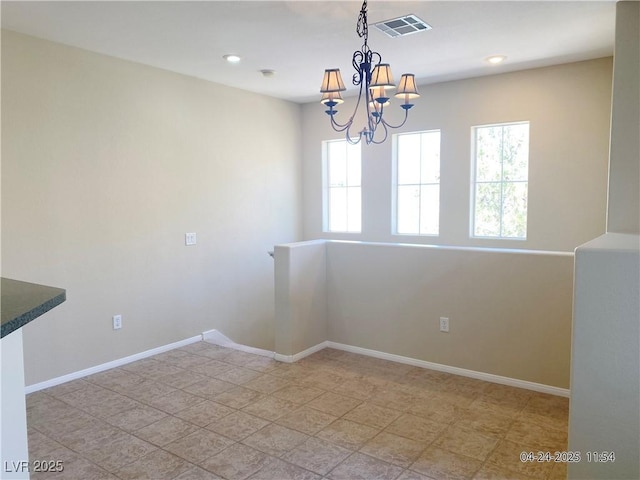 10190 Deerfield Beach Ave Unit 202, Las Vegas, NV 89129 - spare room featuring a chandelier, baseboards, and recessed lighting