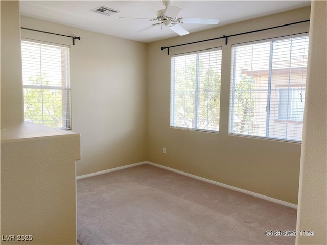 10190 Deerfield Beach Ave Unit 202, Las Vegas, NV 89129 - empty room featuring light carpet, a ceiling fan, and baseboards
