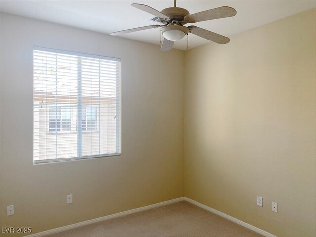 10190 Deerfield Beach Ave Unit 202, Las Vegas, NV 89129 - unfurnished room with light carpet, ceiling fan, and baseboards