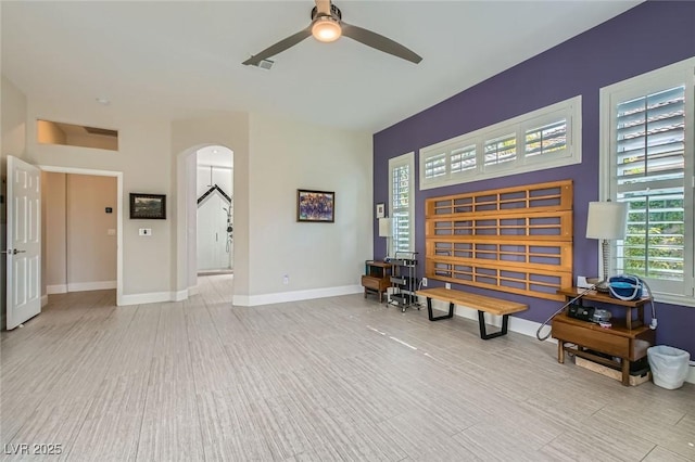 1314 Doggett Ave, Las Vegas, NV 89123 - living area with a ceiling fan, arched walkways, and baseboards