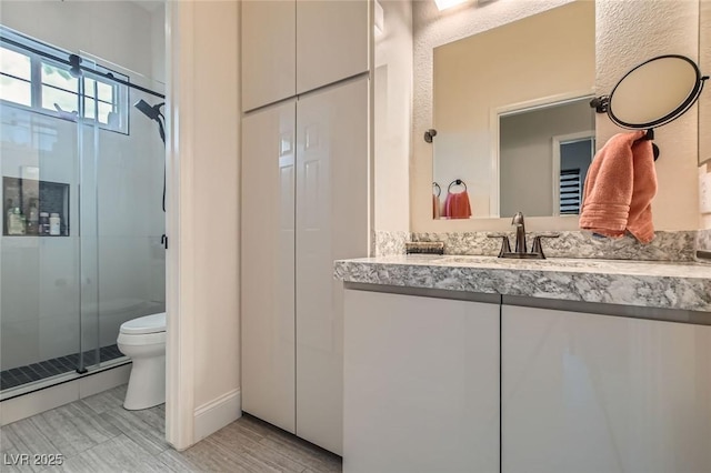 1314 Doggett Ave, Las Vegas, NV 89123 - full bath featuring vanity, a shower stall, and toilet