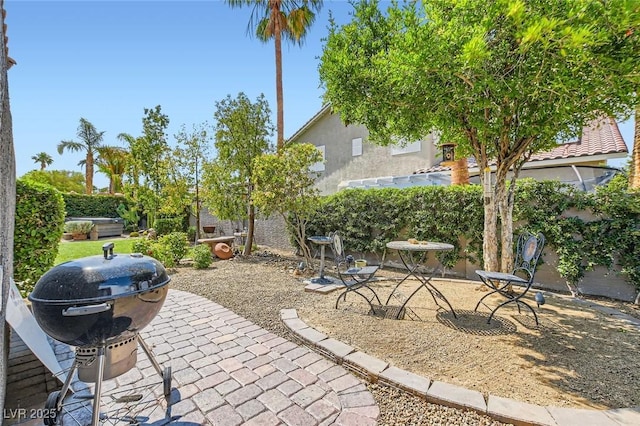 1314 Doggett Ave, Las Vegas, NV 89123 - fenced backyard with a patio and grilling area