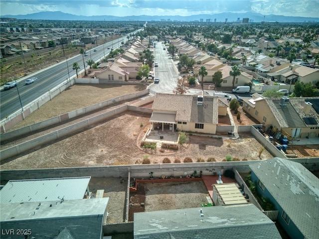 4878 Califa Dr, Las Vegas, NV 89122 - aerial perspective of suburban area with a mountainous background