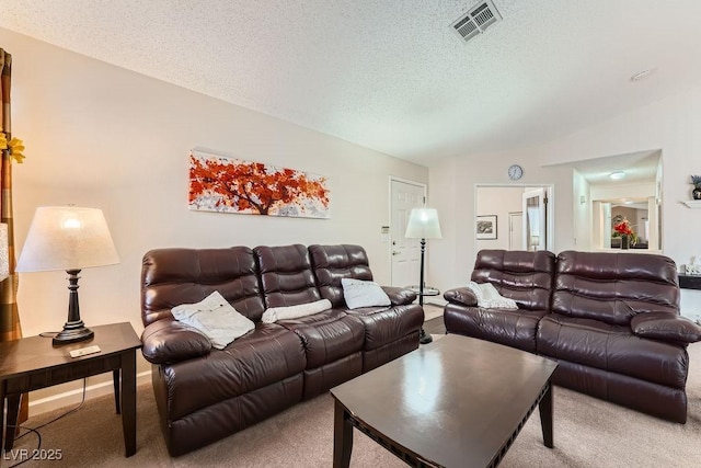 605 Devonhall St Unit 201, Las Vegas, NV 89145 - carpeted living area with lofted ceiling and a textured ceiling