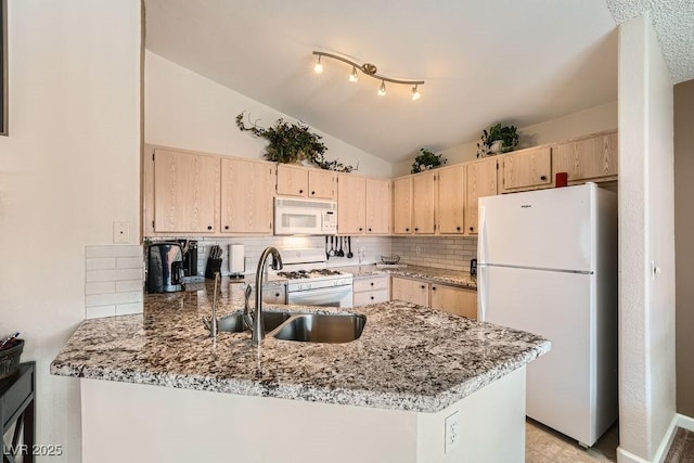 605 Devonhall St Unit 201, Las Vegas, NV 89145 - kitchen with white appliances, light brown cabinetry, a sink, a peninsula, and light stone countertops