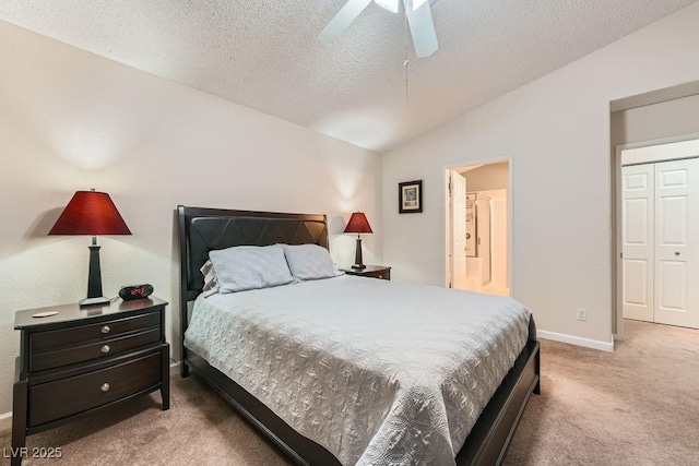 605 Devonhall St Unit 201, Las Vegas, NV 89145 - bedroom with carpet flooring, vaulted ceiling, a textured ceiling, baseboards, and a ceiling fan